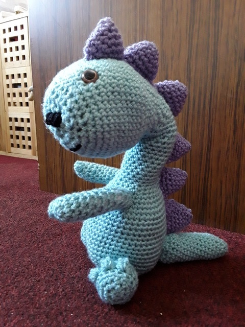 Gill has crocheted a dinosaur for her three year old granddaughter,